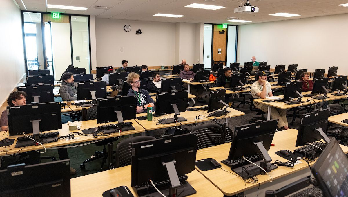 Workshop participants learning at computer workstations